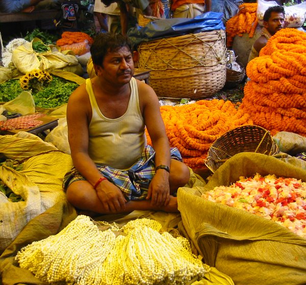 A_seller_at_the_Flower_Market_Calcutta.jpg